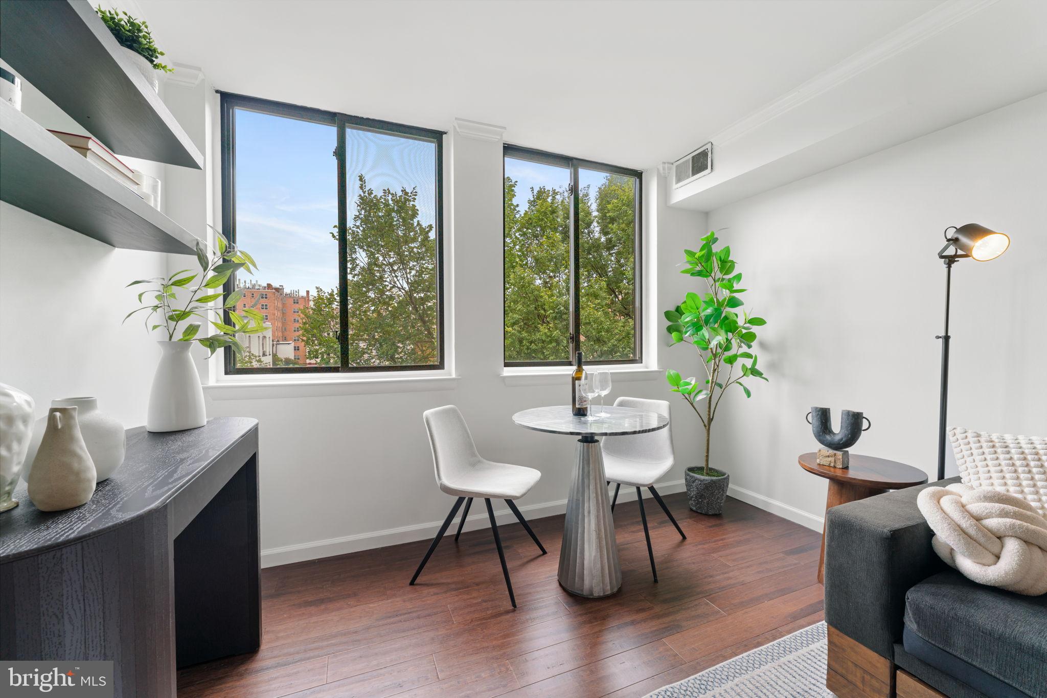 1700 17th Street Northwest, Unit 508 Washington, DC 20009 - Photo 12 of 24 a view of a dining room with furniture window and wooden floor