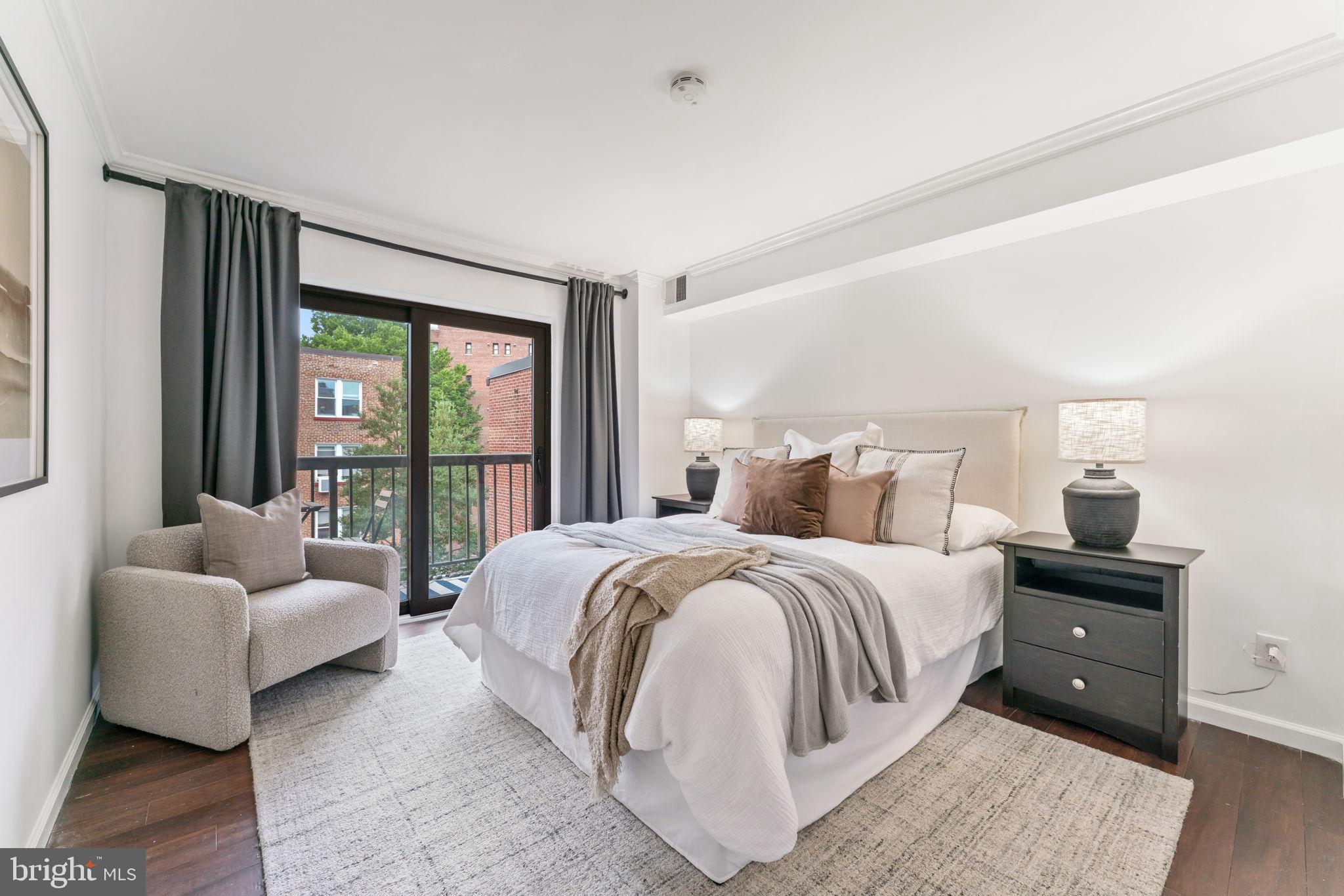 1700 17th Street Northwest, Unit 508 Washington, DC 20009 - Photo 15 of 24 a spacious bedroom with a bed and a couch