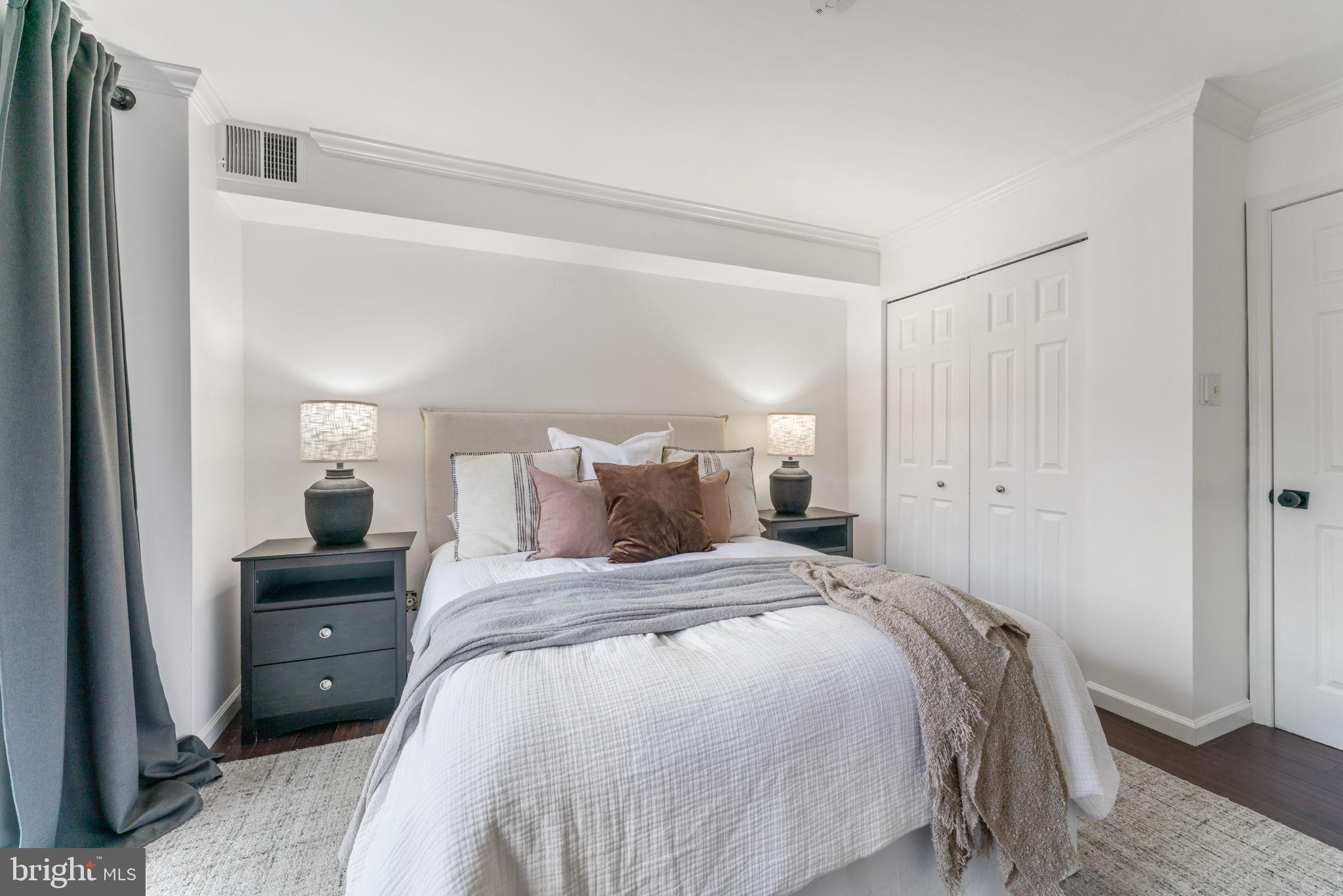 1700 17th Street Northwest, Unit 508 Washington, DC 20009 - Photo 17 of 24 a bedroom with a bed and a tv