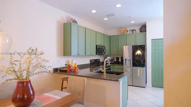 a living room with furniture and a lamp