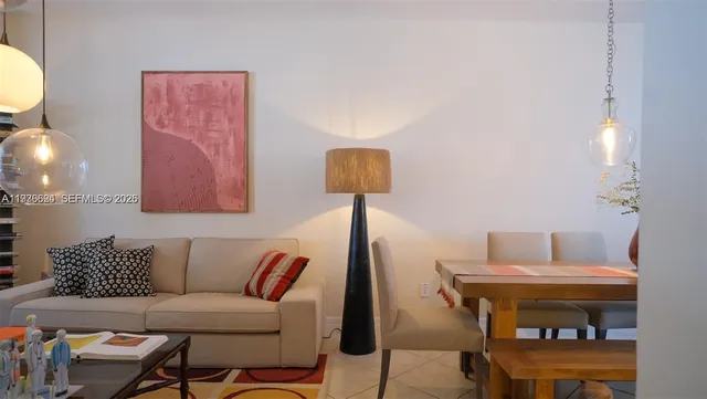 a dining room with furniture and wooden floor