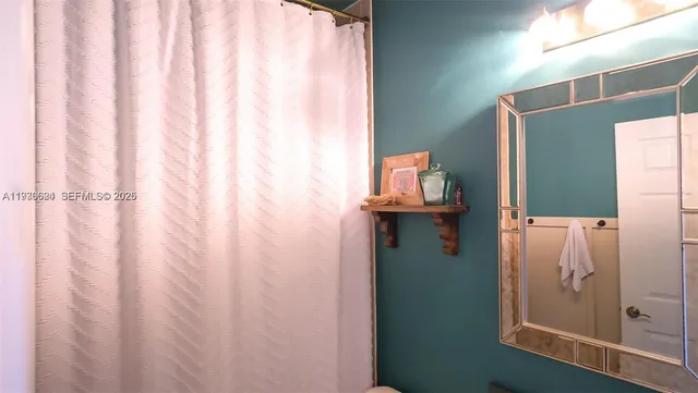 a view of bathroom with washer and dryer