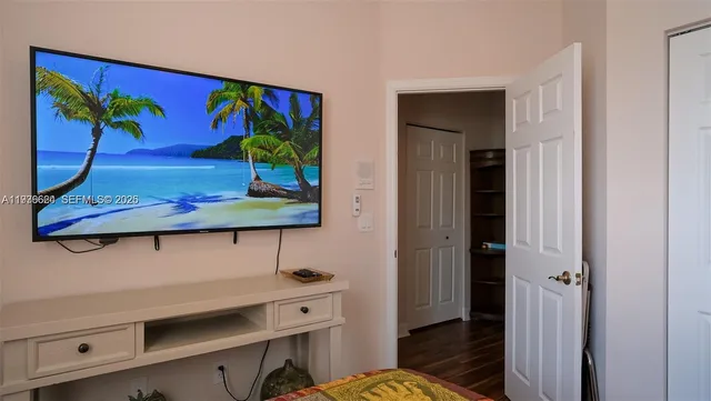 a view of a hallway with paintings on the wall