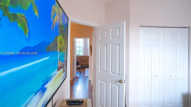 a view of hall way with furniture