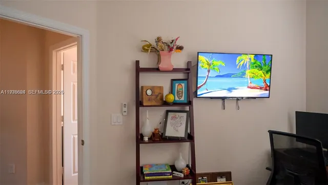 a bedroom with a bed a rug and a closet