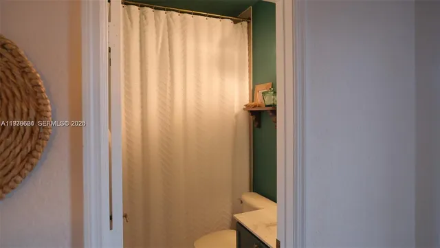 a picture of a bathroom with a hardwood