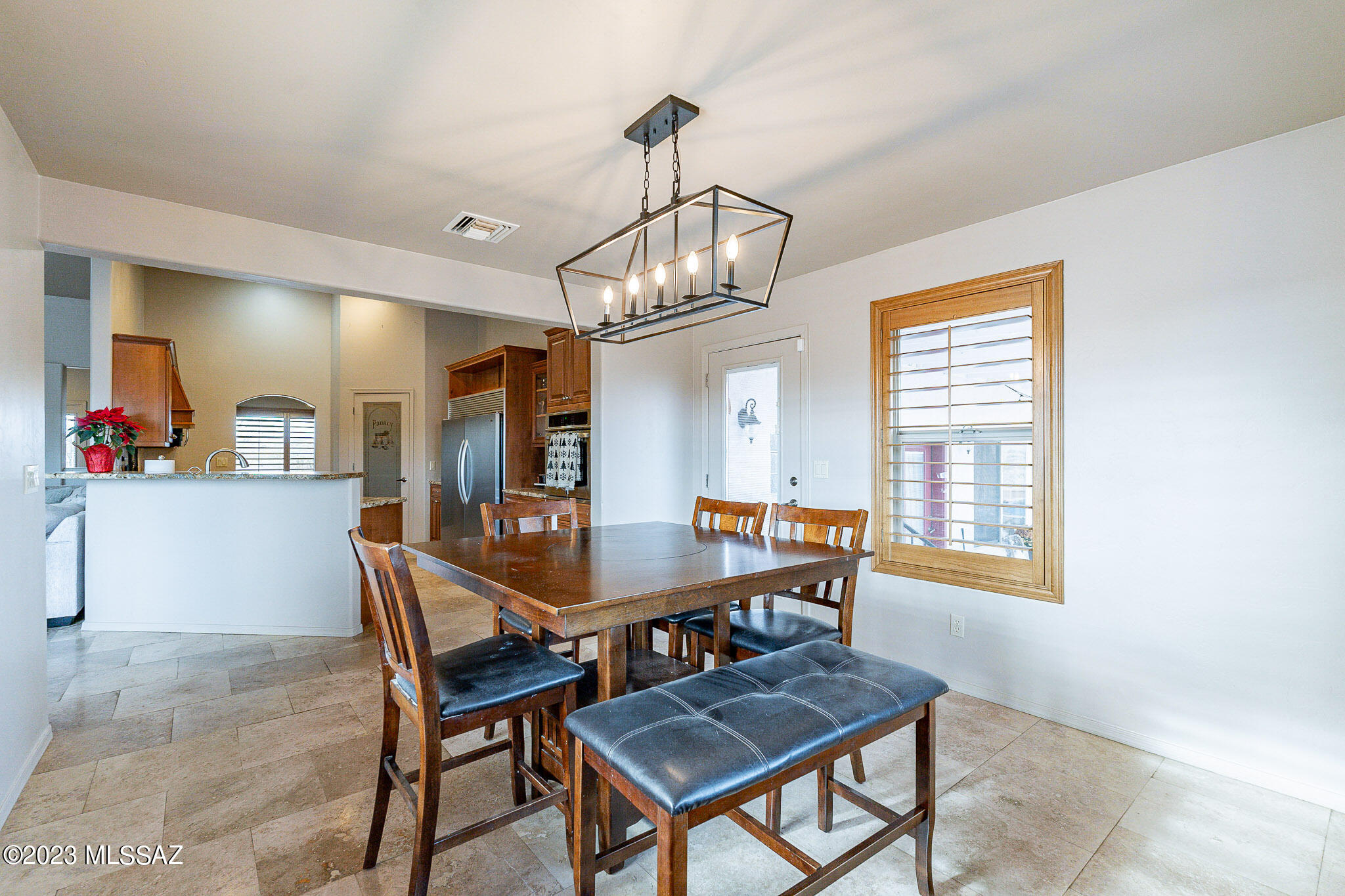 1135 Via San Francisco Rio Rico, AZ 85648 - Photo 14 of 29 a view of a dining room with furniture window and wooden floor