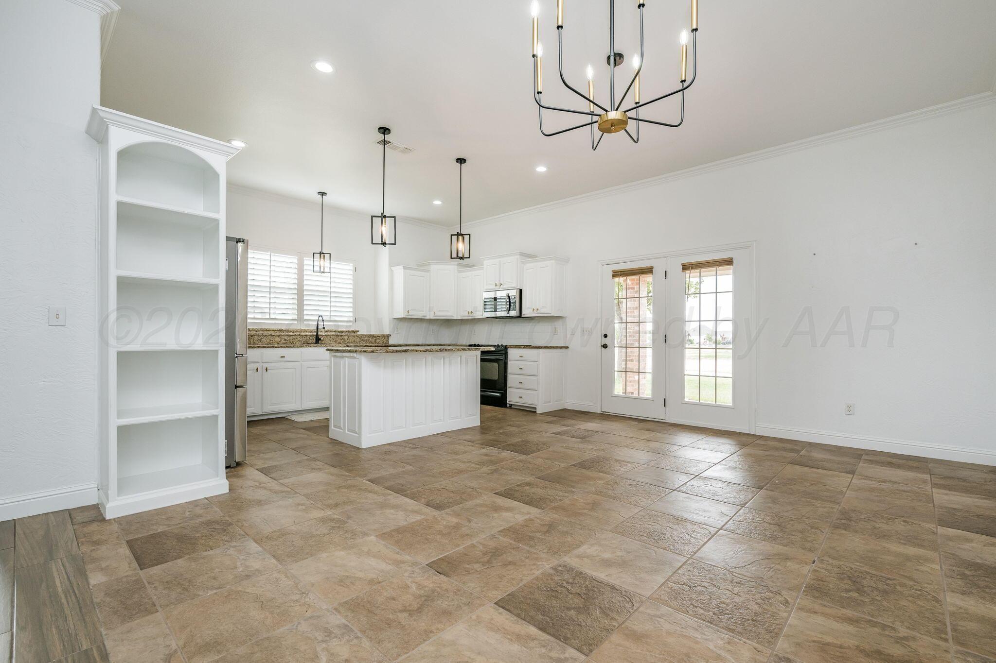 16700 Dove Meadow Road Canyon, TX 79015 - Photo 5 of 24 a view of a kitchen with a sink and a window