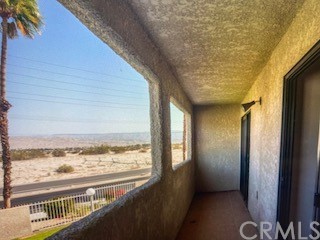 34049 Emily Way Rancho Mirage, CA 92270 - Photo 1 of 1 a view of a room with wooden floor and windows