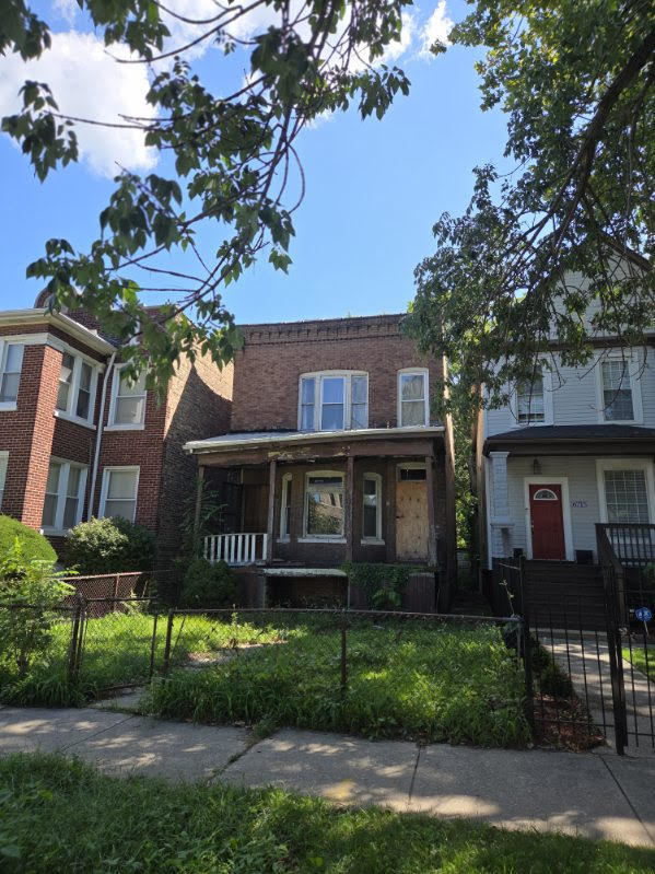 a house view with a garden space