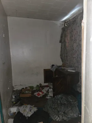 a living room with furniture a mirror and a fireplace