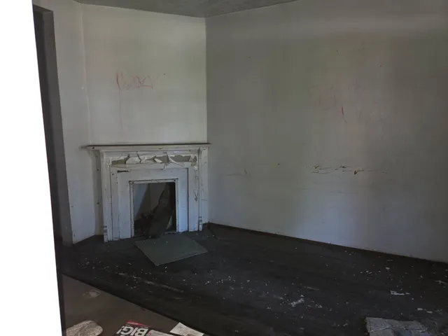 a living room with a fireplace