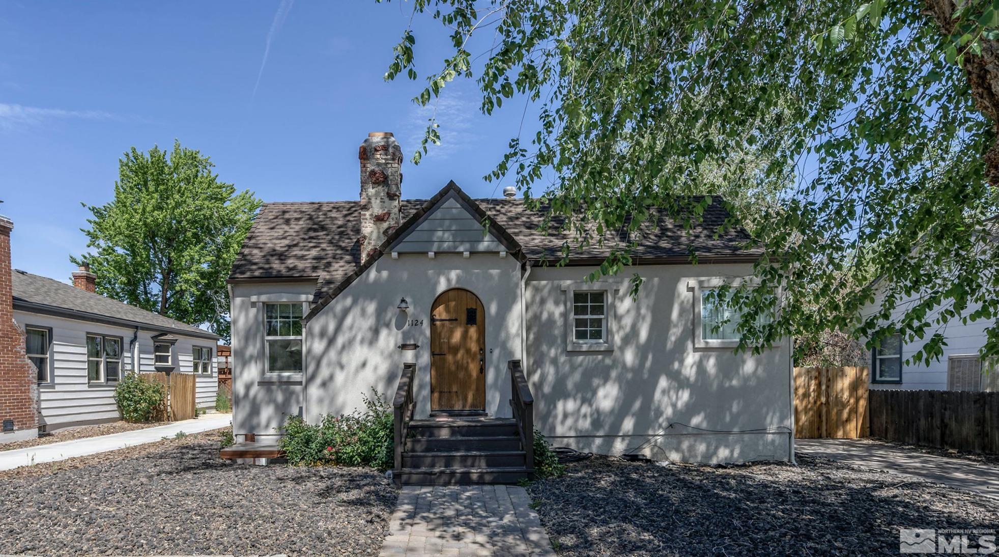 1124 Bon Rea Way Reno, NV 89503 - Photo 1 of 18 a front view of a house with garden
