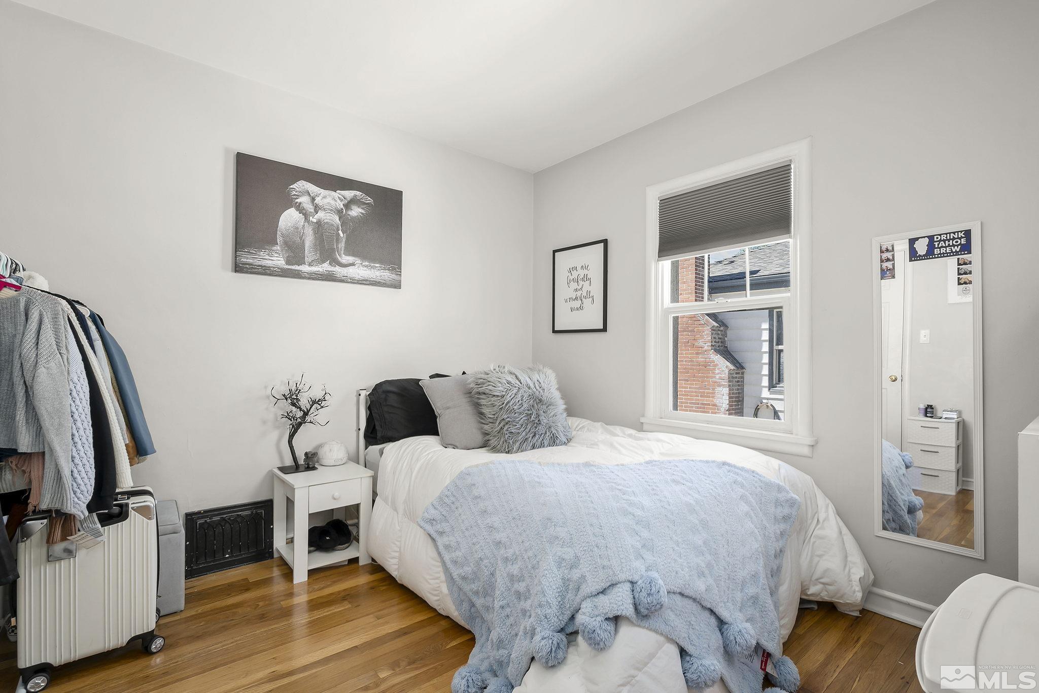1124 Bon Rea Way Reno, NV 89503 - Photo 11 of 18 a bedroom with a bed and wooden floor