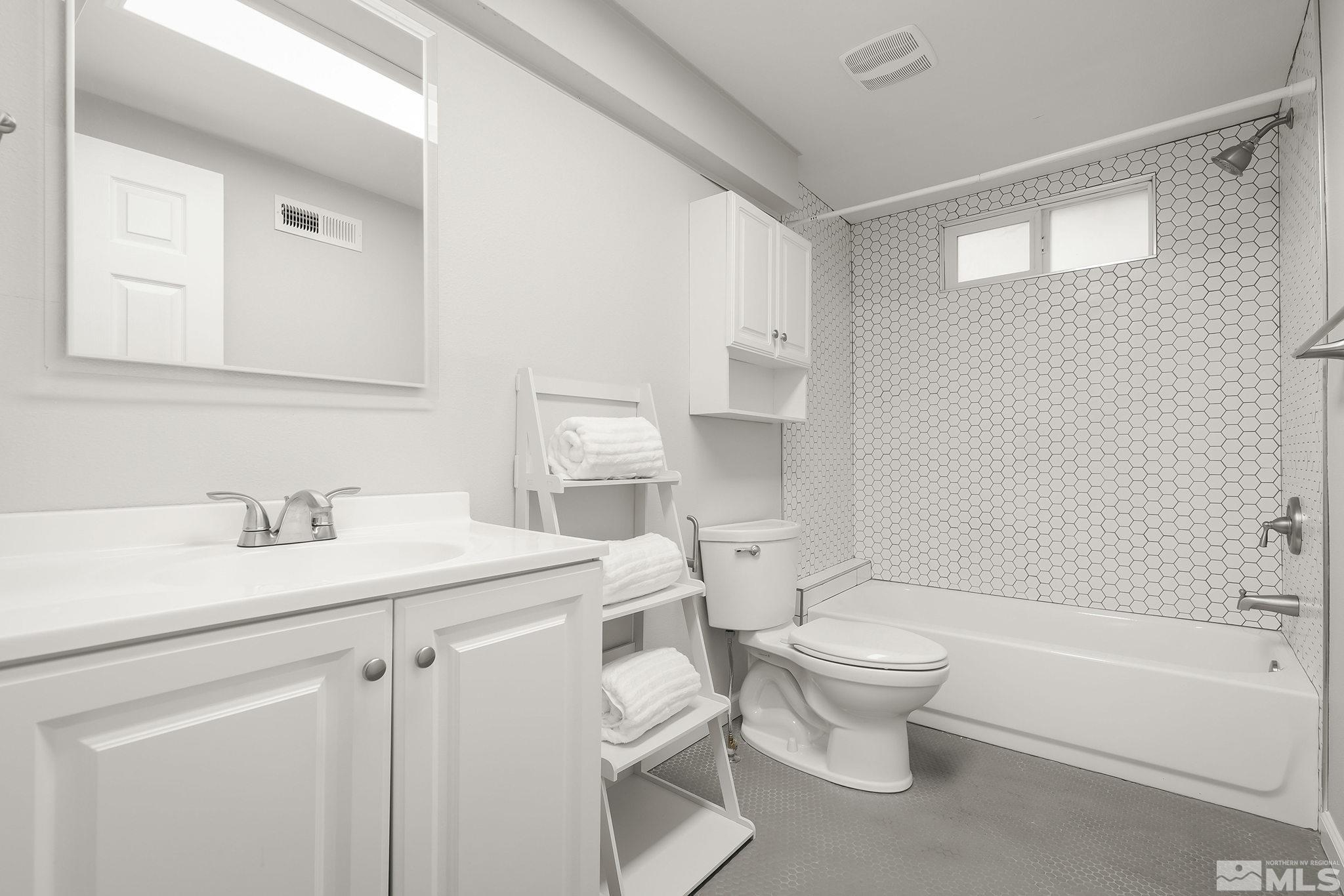 1124 Bon Rea Way Reno, NV 89503 - Photo 14 of 18 a bathroom with a sink toilet vanity and tub