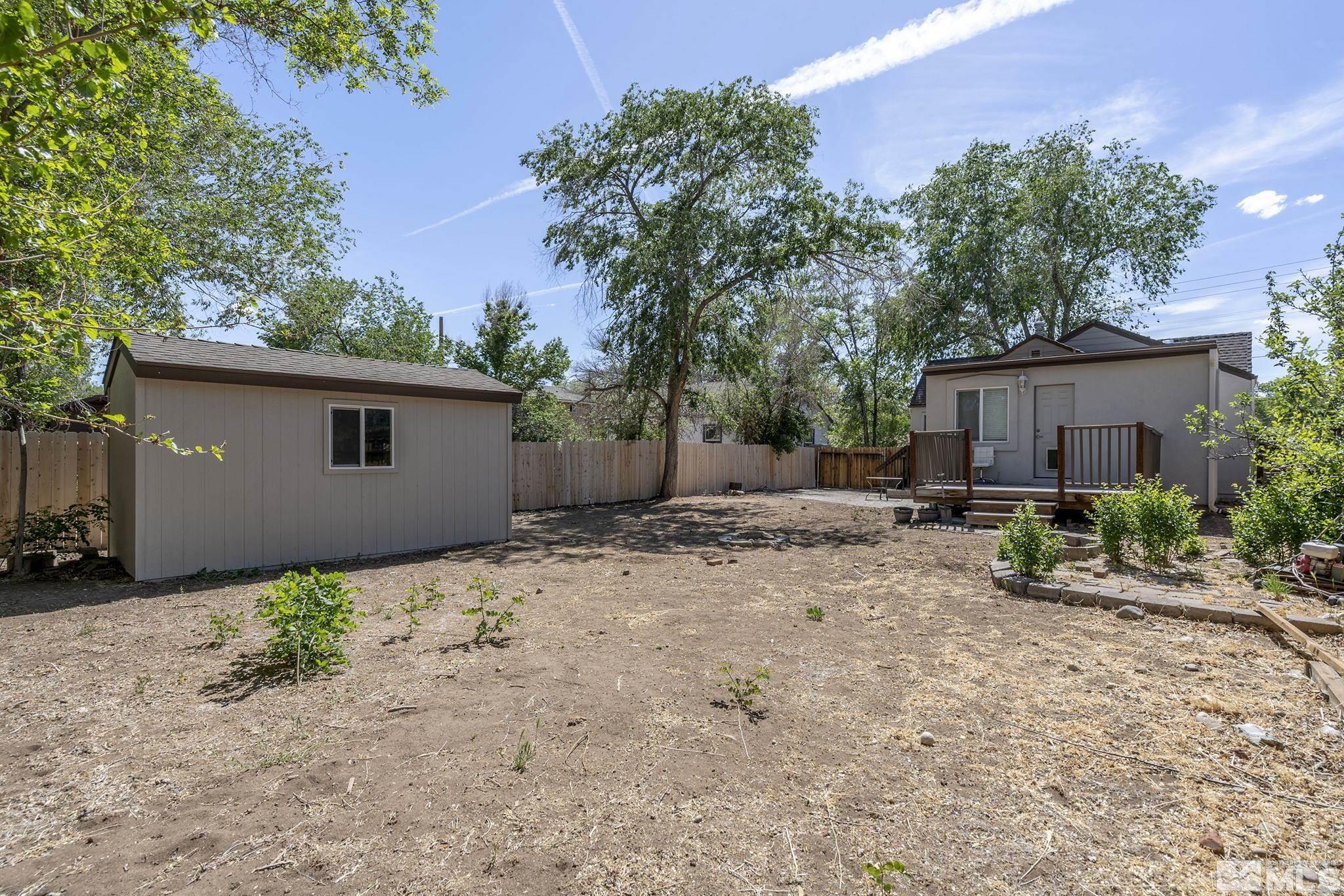 1124 Bon Rea Way Reno, NV 89503 - Photo 18 of 18 a backyard of a house with plants and trees