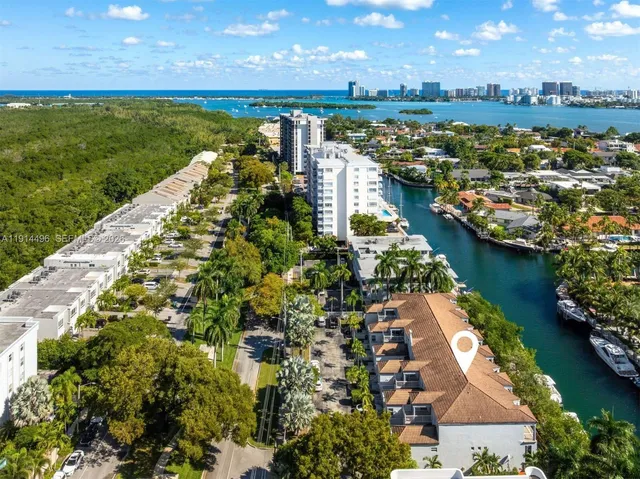 an aerial view of residential building and lake