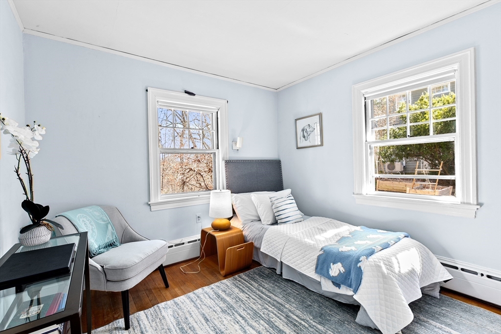 25 Duffield Road Newton, MA 02466 - Photo 13 of 19 a bedroom with a bed and wooden floor