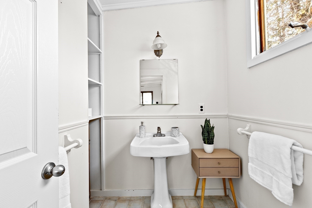 25 Duffield Road Newton, MA 02466 - Photo 16 of 19 a bathroom with a sink and a mirror