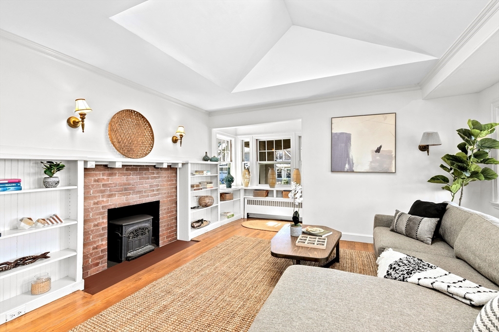 25 Duffield Road Newton, MA 02466 - Photo 4 of 19 a living room with furniture and a fireplace