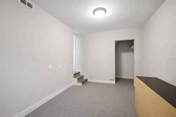a bathroom with a shower and a window