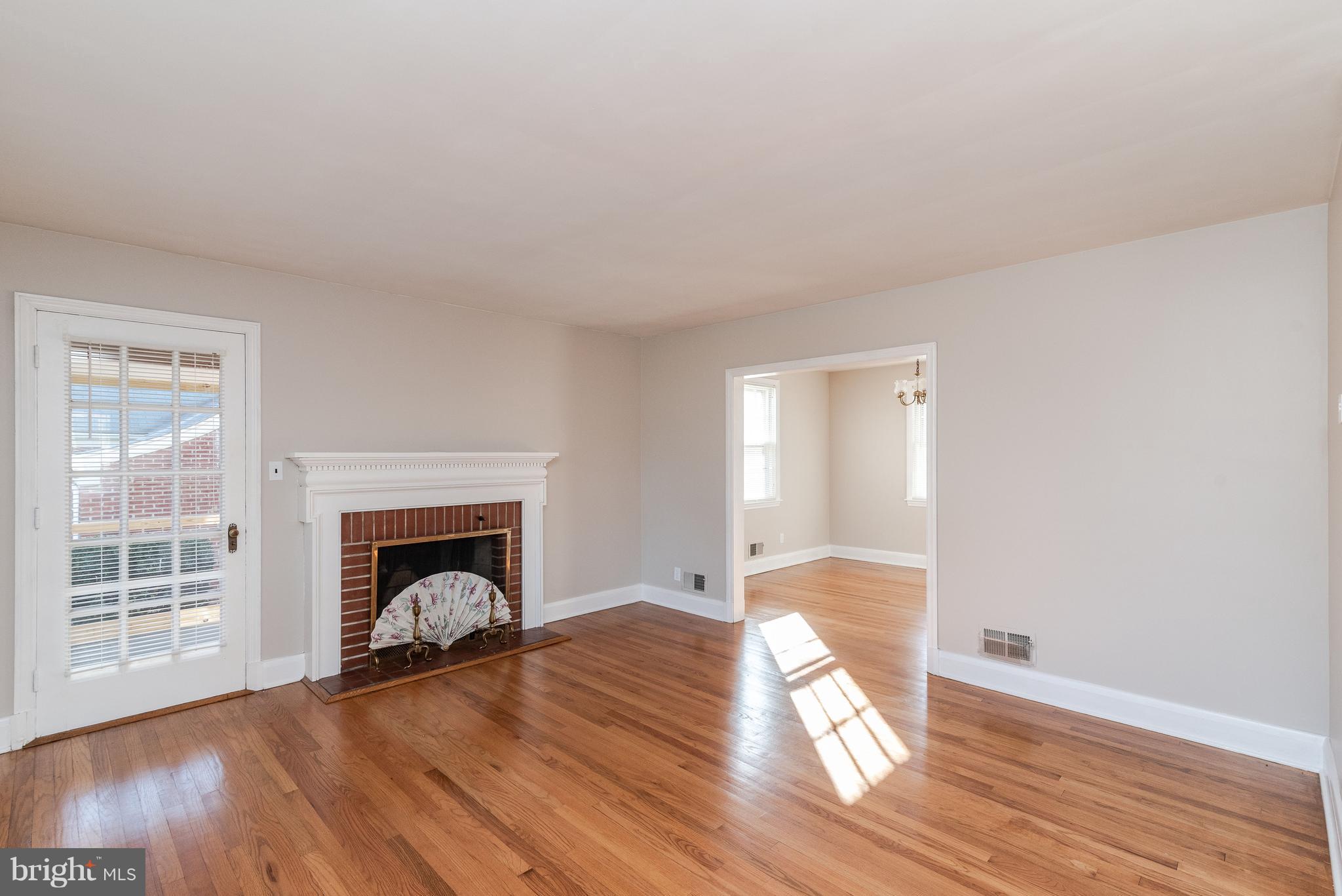509 Forest View Road Linthicum Heights, MD 21090 - Photo 4 of 44 Living Room with Fireplace and Screen Porch