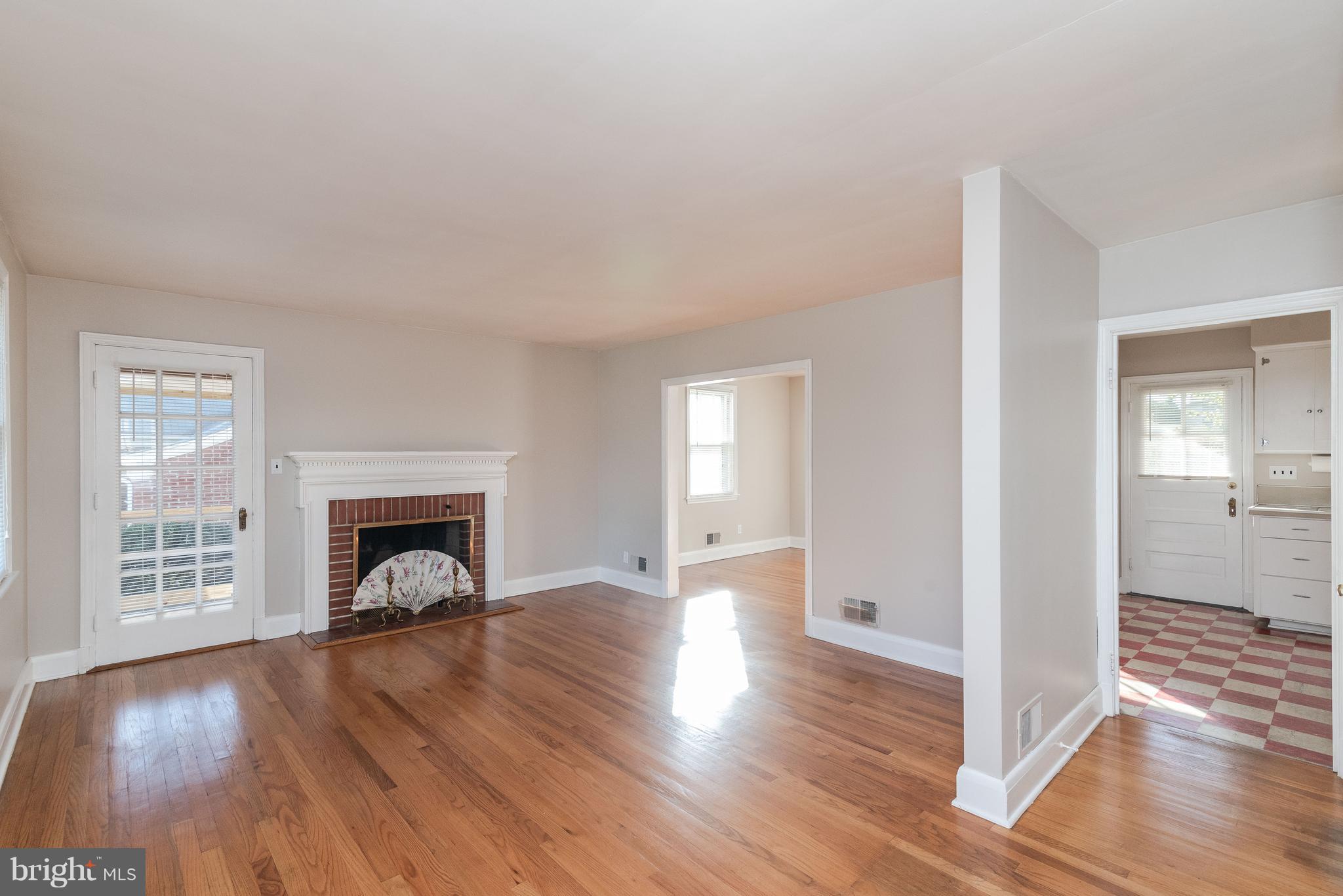 509 Forest View Road Linthicum Heights, MD 21090 - Photo 5 of 44 Living Room with Fireplace and Screen Porch