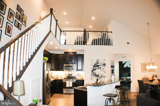 a view of living room kitchen and dining room
