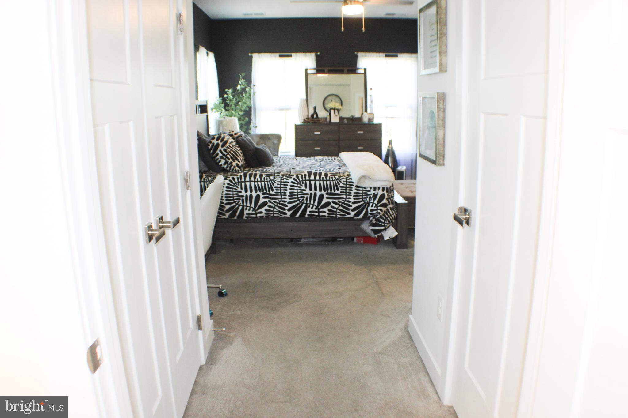 10120 Seattle Slew Lane, Unit P Laurel, MD 20723 - Photo 14 of 22 a bedroom with a bed and a window