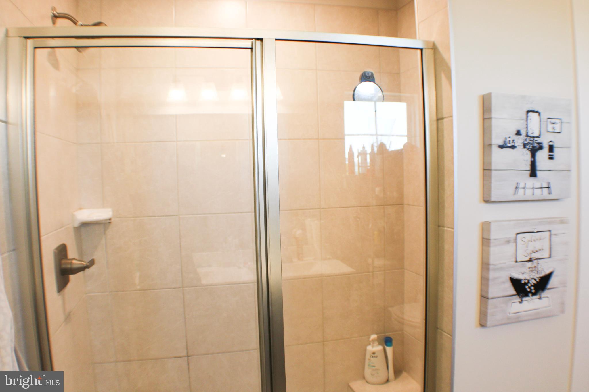 10120 Seattle Slew Lane, Unit P Laurel, MD 20723 - Photo 16 of 22 a bathroom with a shower