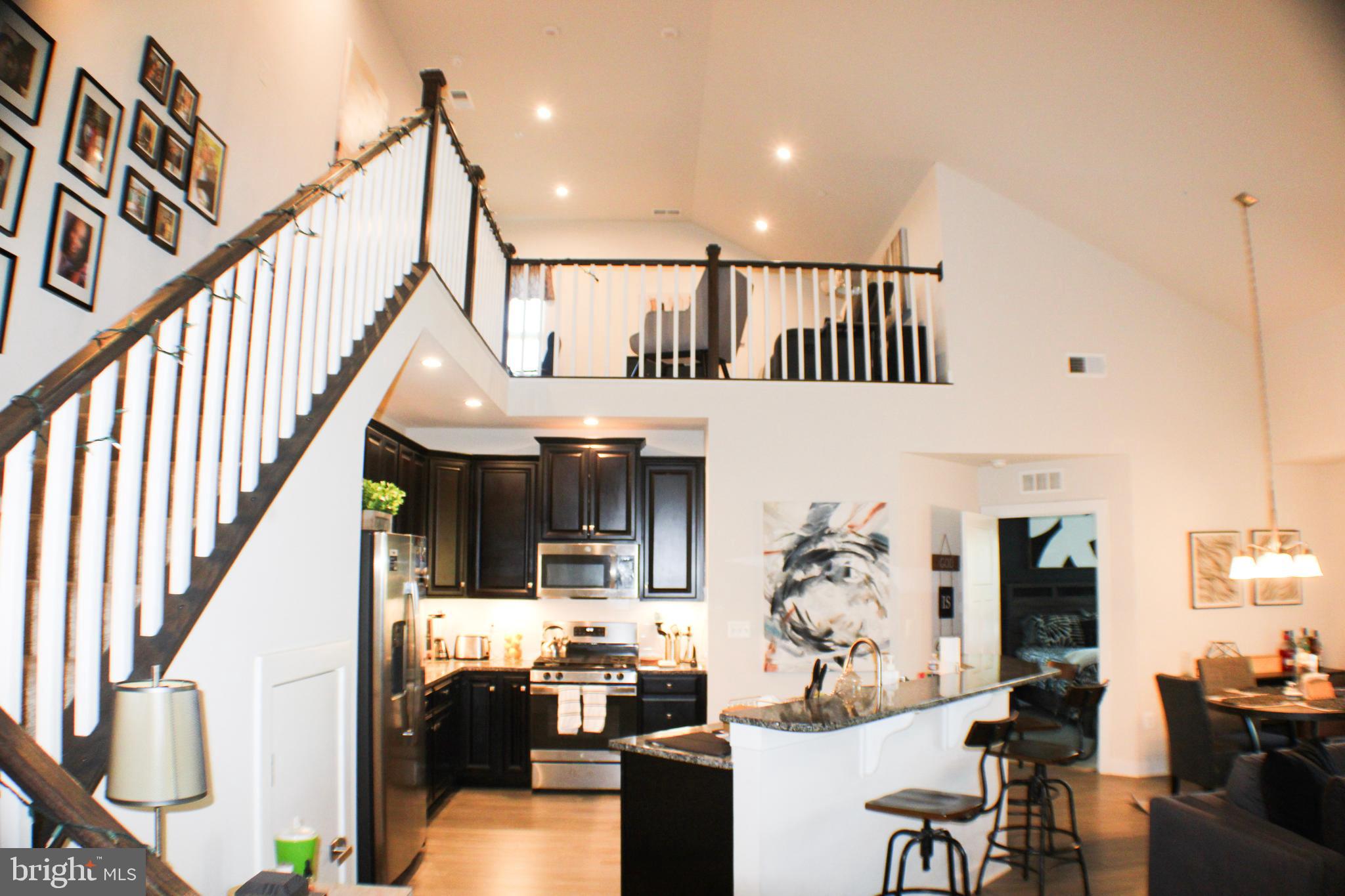 10120 Seattle Slew Lane, Unit P Laurel, MD 20723 - Photo 2 of 22 a view of living room kitchen and dining room