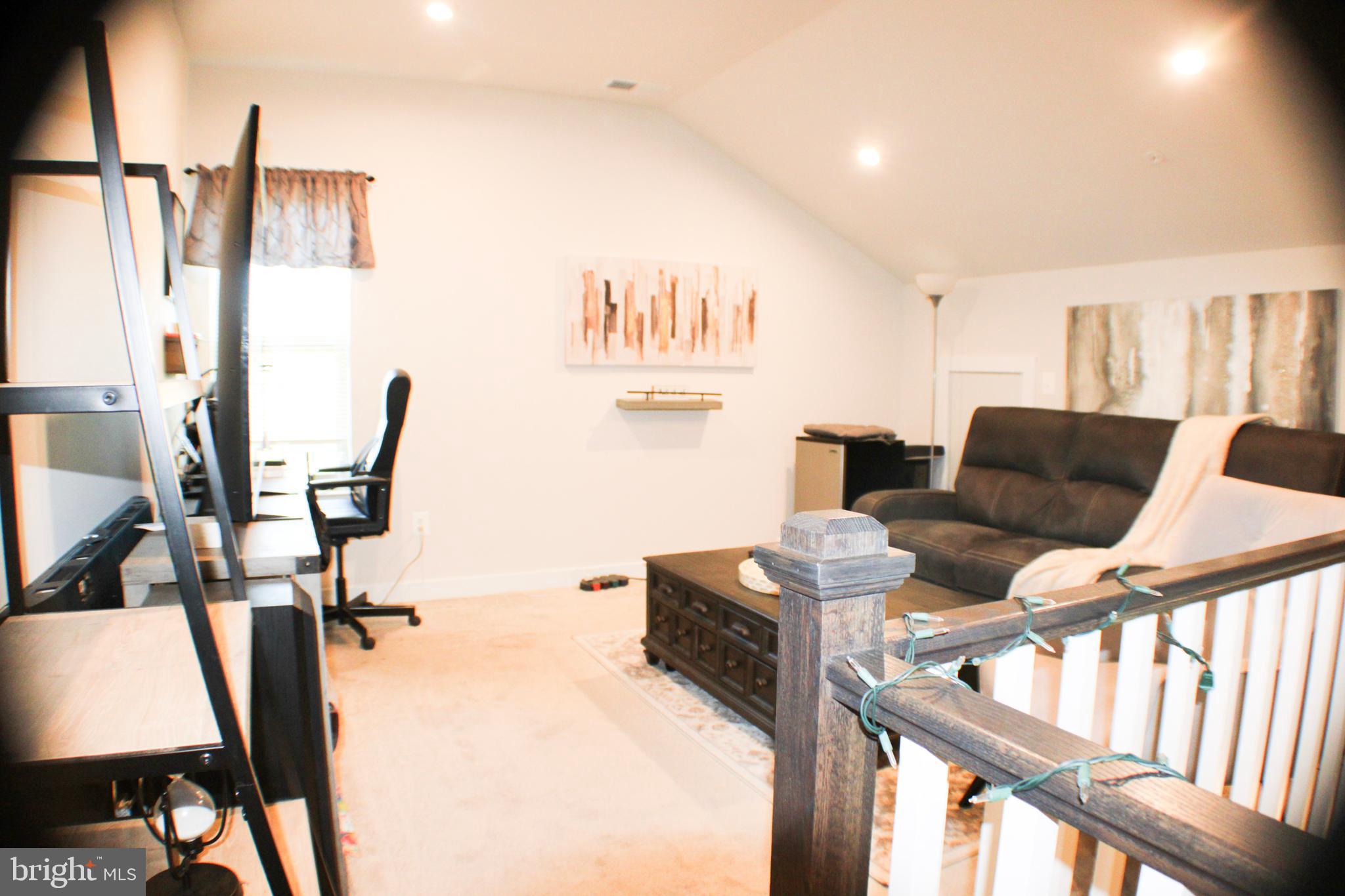 10120 Seattle Slew Lane, Unit P Laurel, MD 20723 - Photo 3 of 22 a living room with furniture and a flat screen tv