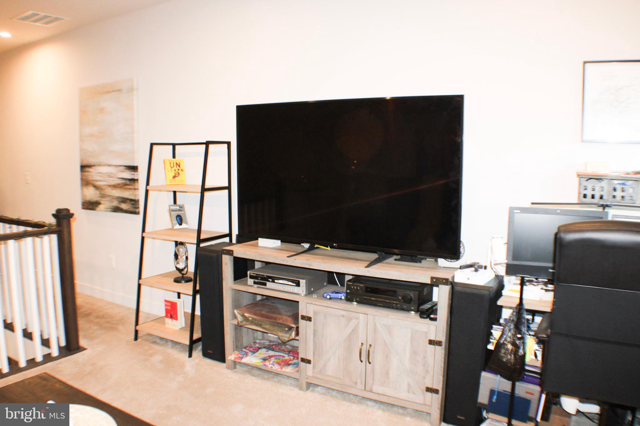10120 Seattle Slew Lane, Unit P Laurel, MD 20723 - Photo 4 of 22 a living room with furniture and flat screen tv