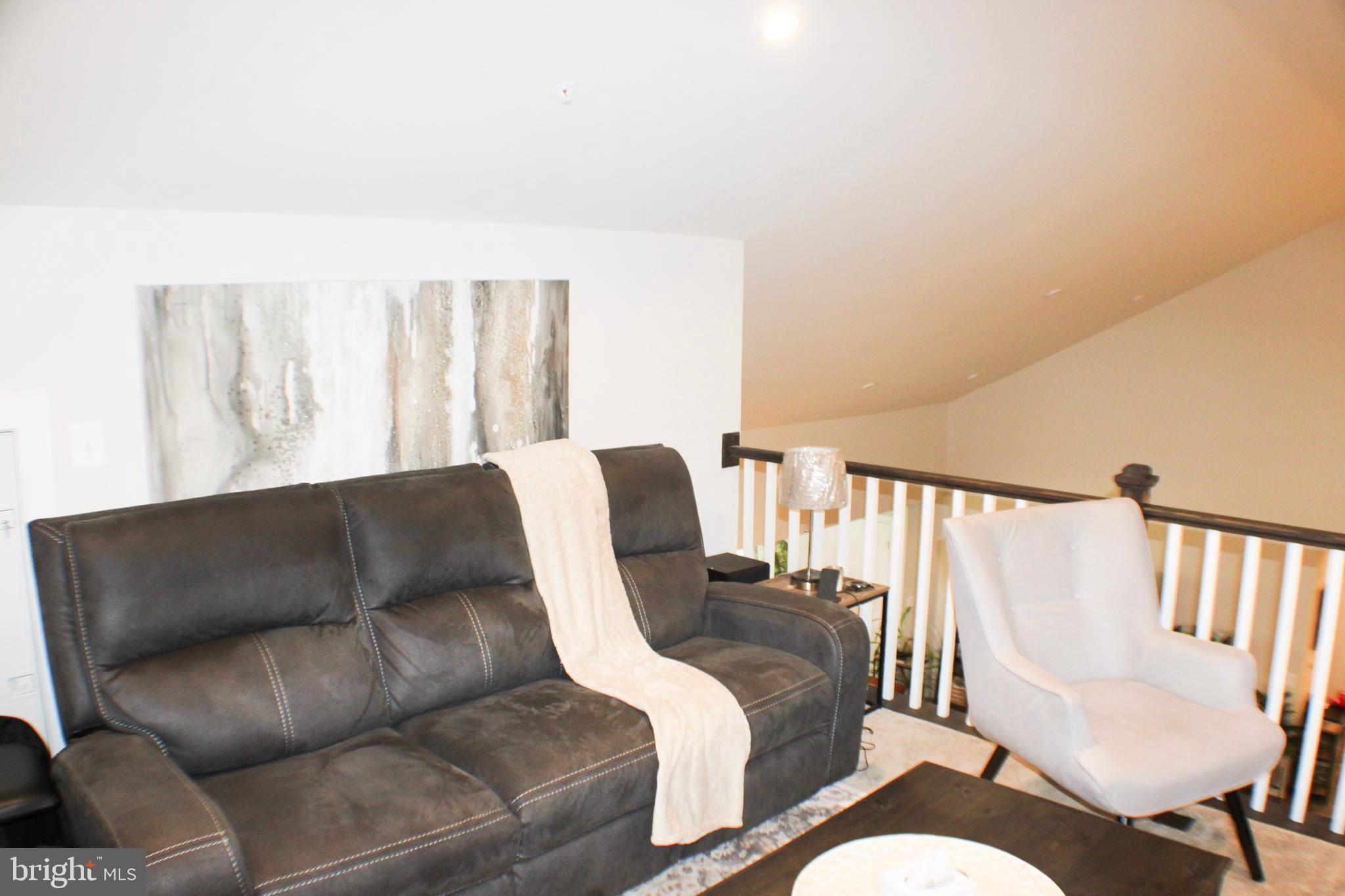 10120 Seattle Slew Lane, Unit P Laurel, MD 20723 - Photo 5 of 22 a living room with furniture and a large window