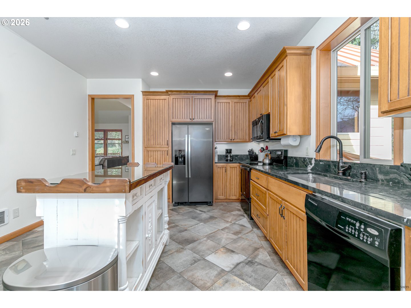 64636 Mc Intyre Road Rhododendron, OR 97049 - Photo 19 of 48 a kitchen with stainless steel appliances granite countertop a sink a stove and a refrigerator