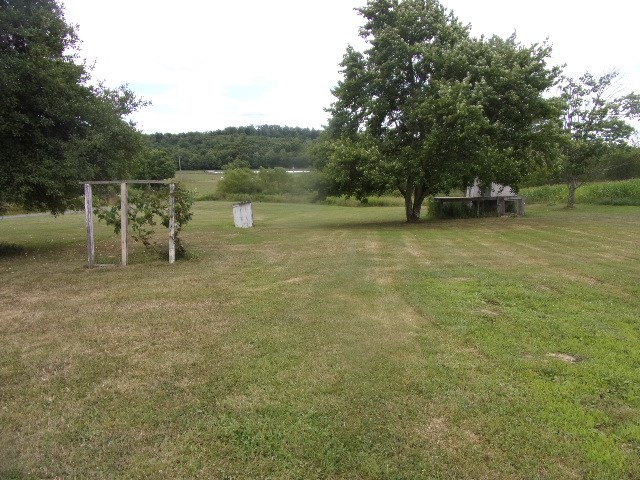 22 Swartfager Road New Bethlehem, PA 16242 - Photo 4 of 6 a view of a lake with a bench