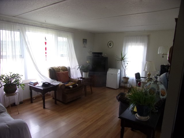 22 Swartfager Road New Bethlehem, PA 16242 - Photo 5 of 6 a living room with furniture a piano and a potted plant
