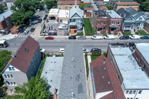an aerial view of residential houses with outdoor space