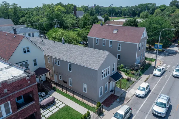 an aerial view of a house with a yard