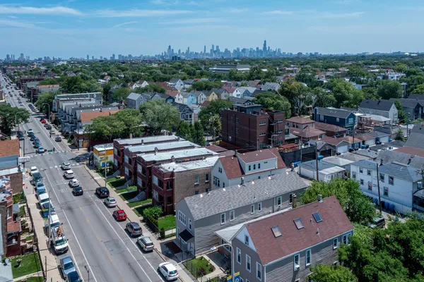 an aerial view of a city with lots of residential buildings