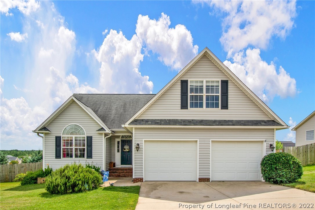 5415 Spreading Branch Road Hope Mills, NC 28348 - Photo 1 of 12 a view of a yard in front view of a house