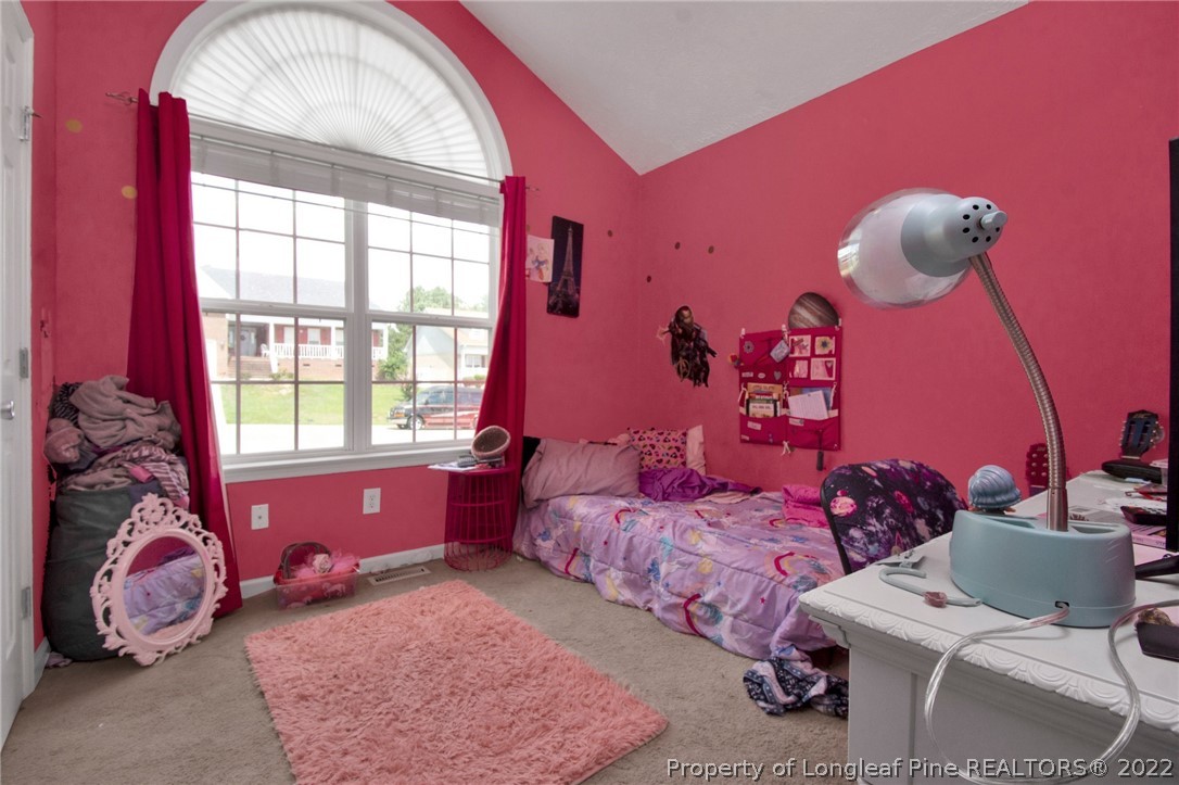 5415 Spreading Branch Road Hope Mills, NC 28348 - Photo 11 of 12 a bedroom with a bed and a window