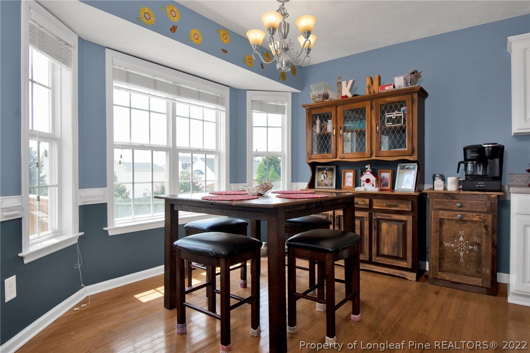 5415 Spreading Branch Road Hope Mills, NC 28348 - Photo 6 of 12 a view of a dining room with furniture window and wooden floor