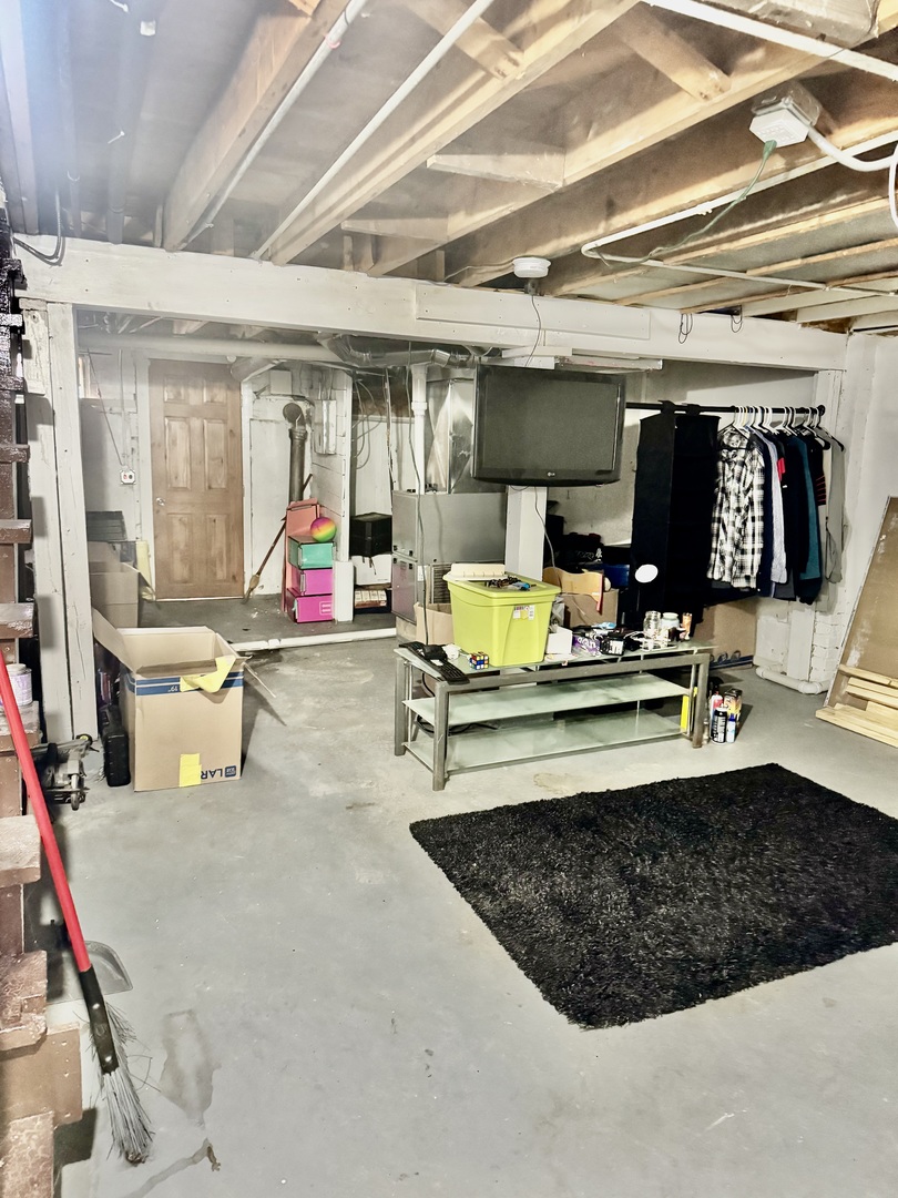 11345 South Ada Street Chicago, IL 60643 - Photo 14 of 15 a living room with furniture a flat screen tv and floor to ceiling window