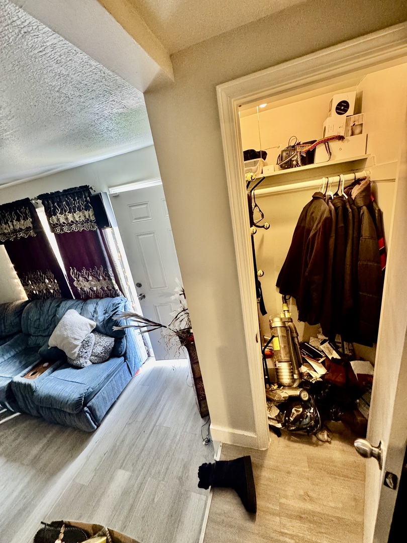 11345 South Ada Street Chicago, IL 60643 - Photo 9 of 15 a view of walk in closet with clothes and shoes