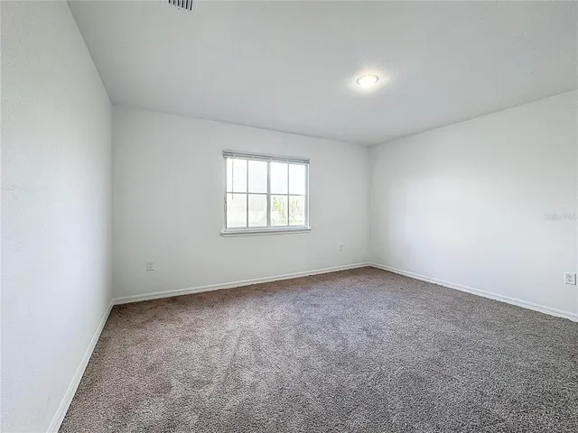 a white toilet sitting next to a bath tub and a shower