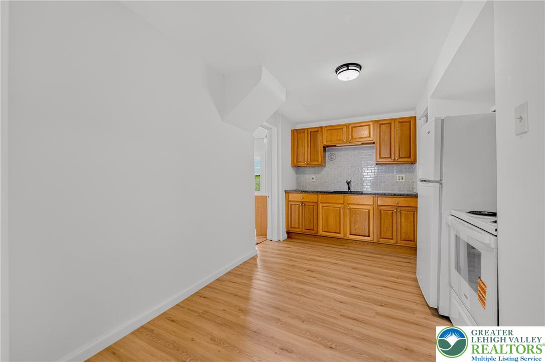 313 Main Street Slatington, PA 18080 - Photo 28 of 73 A well-appointed kitchen features ample cabinetry and a clean aesthetic, complementing the contiguous living space.