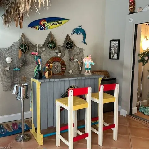 a bed room with a bed and a chandelier