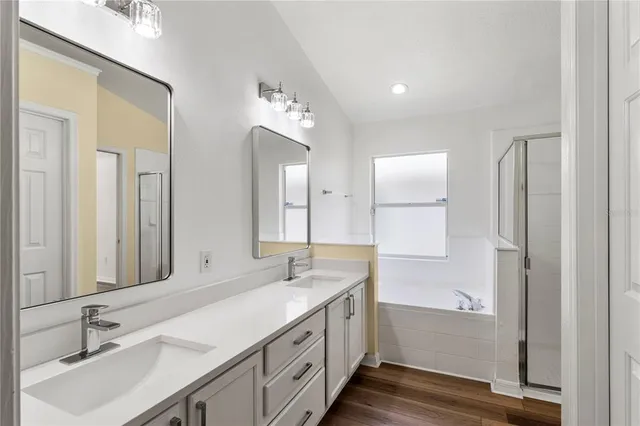 a bathroom with a double vanity sink mirror and double