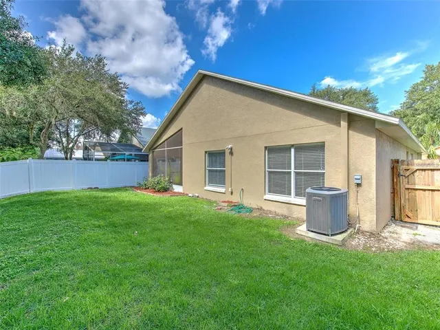 a backyard of a house with seating space